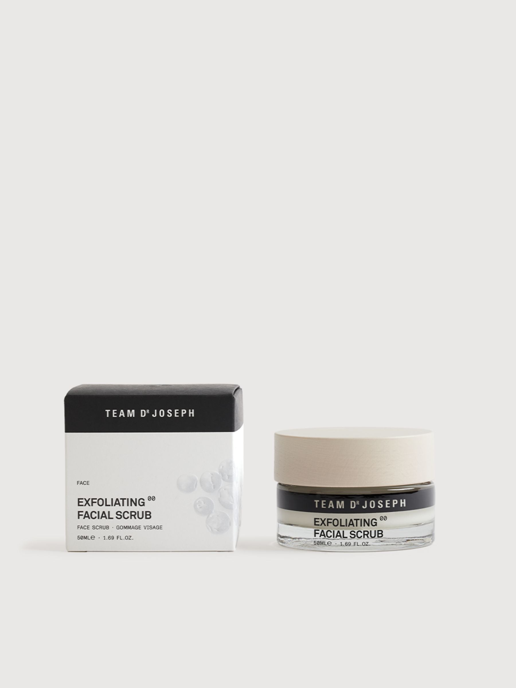 Exfoliating facial scrub by TEAM DR JOSEPH in a 50 ml tube, showing the product with textured scrub particles and branding.