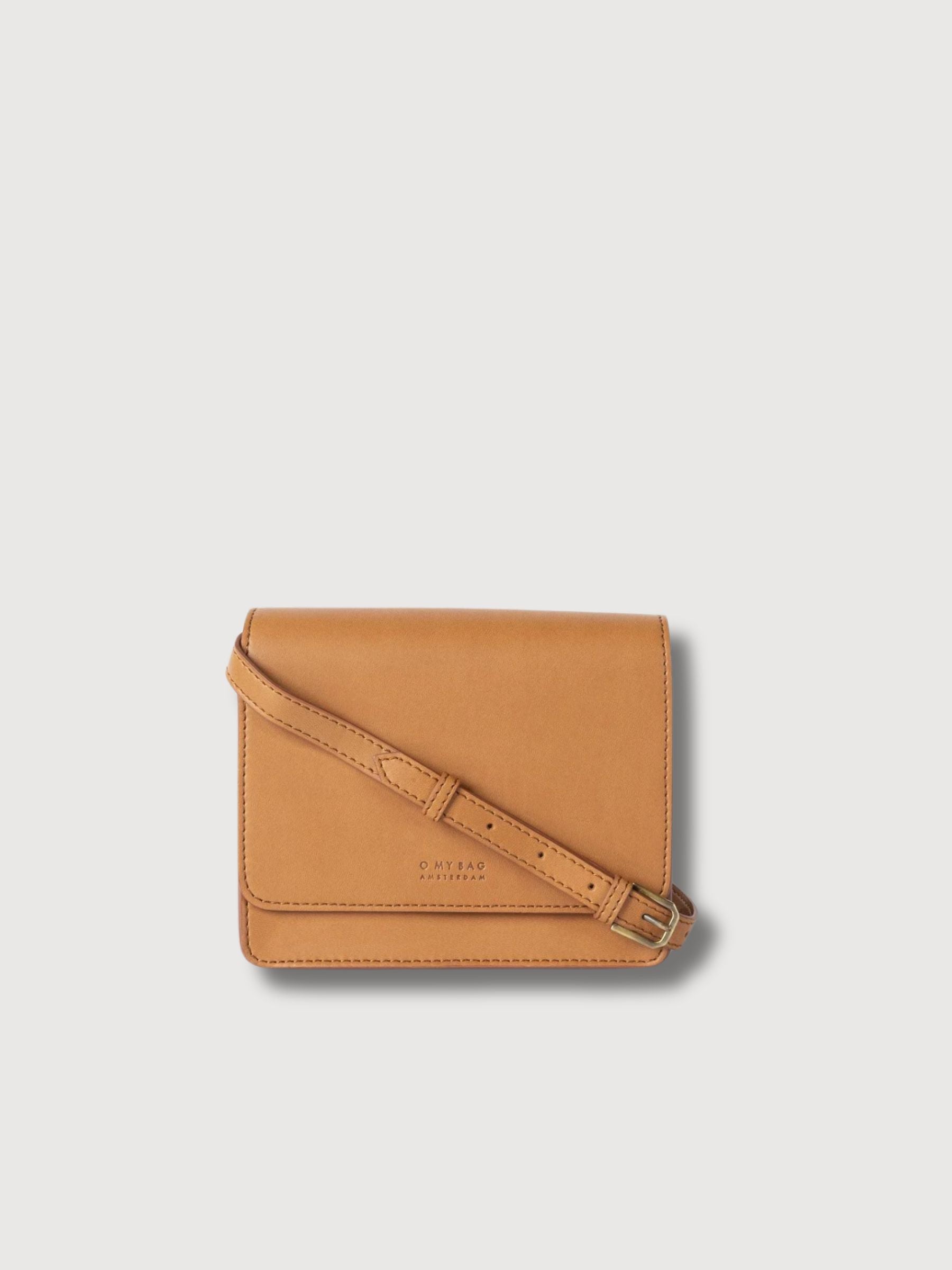 O My Bag Audrey Mini Cognac Appleskin bag with top handle and structured design, showcasing its textured surface and compact silhouette.