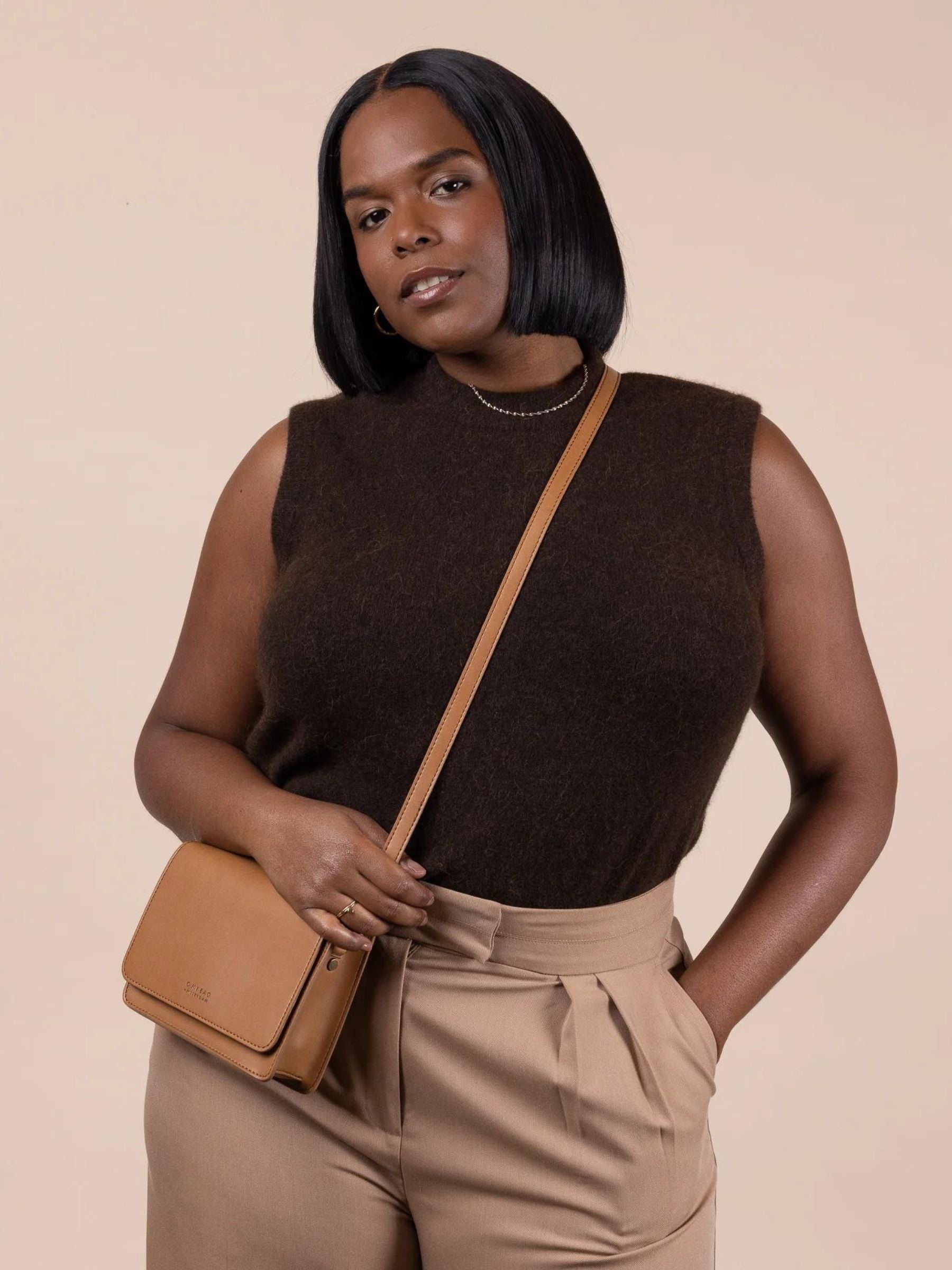 O My Bag Audrey Mini Cognac Bag crafted from Appleskin leather, featuring a compact, stylish design with a top handle.