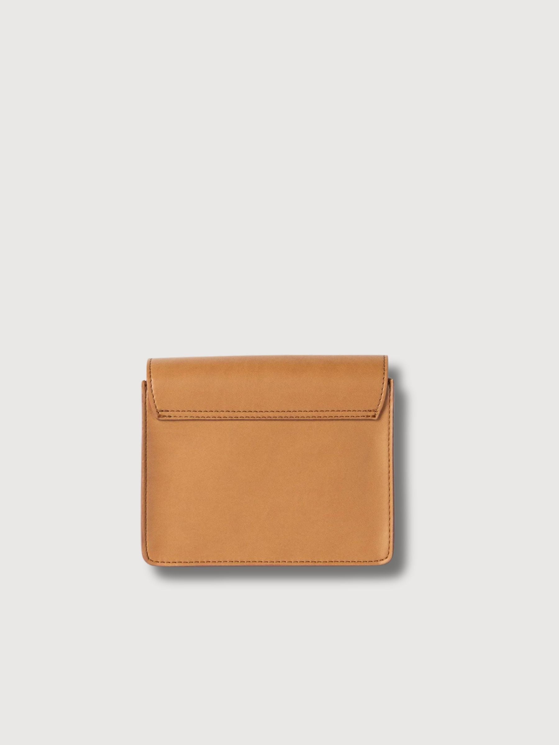 Audrey Mini Cognac Bag by O MY BAG made of appleskin leather, featuring a compact design with a shoulder strap and stylish hardware.